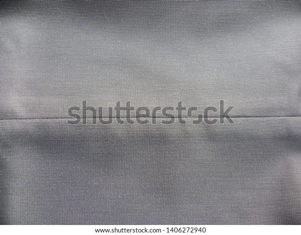 Gray cotton fabric with\
seam on middle