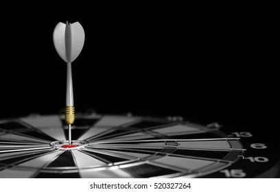 Gray dart hitting the center of target. - Shutterstock ID 520327264