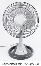 A Gray Electric Table Fan, Isolated On White Background.