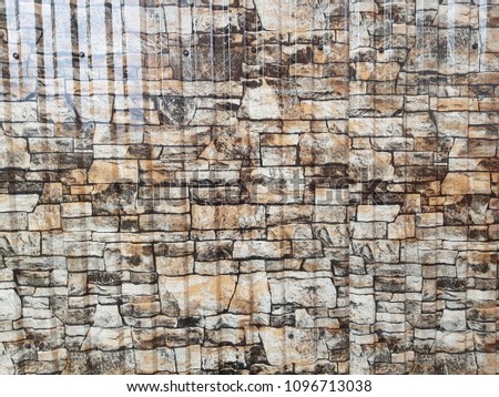 Gray facade facing tiles, imitating a stone. Background texture.