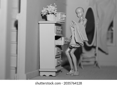 Gray figure within her home