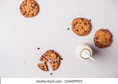 gray food Background with chocolate chip cookies and bottle of milk - Powered by Shutterstock