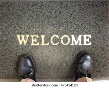 Gray Foot Scraper Mat With Officer Standing