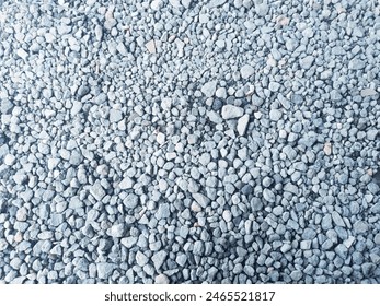 Gray gravel with small, uneven stones, creating a textured surface for background  - Powered by Shutterstock