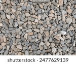 Gray gravel stones for the construction industry. Gravel stones near the railway track. Texture. Background