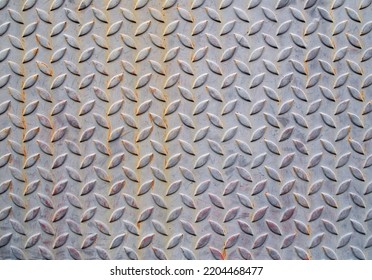 Gray Grunge Diamond Metal Plate Texture Background, Steel Sheet With Small Oval Shape Diagonal Pattern, Embossed Surface Prevents Slipping For Stair Or Walkway And Ramp Floor