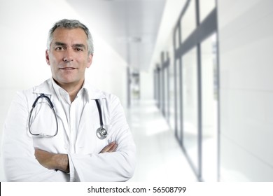 gray hair expertise handsome senior doctor hospital portrait white corridor [Photo Illustration]