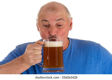 Gray Haired Man Drinking Beer From A Mug