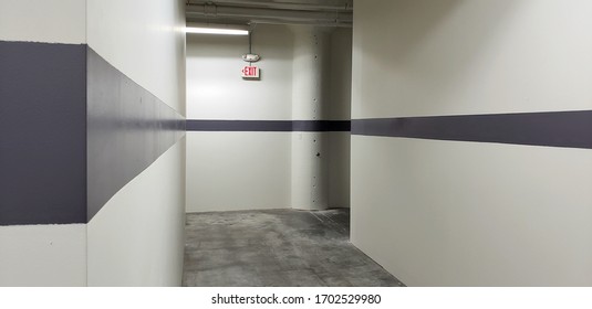 Gray Industrial Hallway Corridor With Exit Sign Background