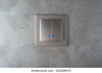 Gray Light Switch On The Gray Wall