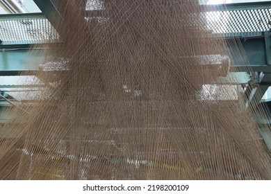 Gray Linen Threads On A Jacquard Loom.