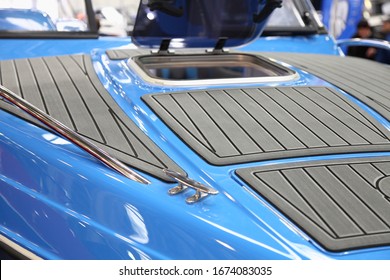 Gray Marine Teak On Blue Motor Boat Bow Deck Close Up With Opened Porthole Window