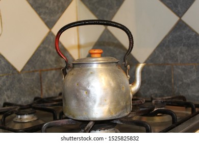 

Gray Metal Kettle On A Dull Kitchen