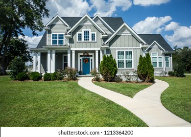 Gray New Construction Modern Cottage Home with Hardy Board Siding and Teal Door with Curb Appeal