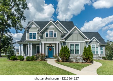 Gray New Construction Modern Cottage Home with Hardy Board Siding and Teal Door with Curb Appeal - Shutterstock ID 1213364227