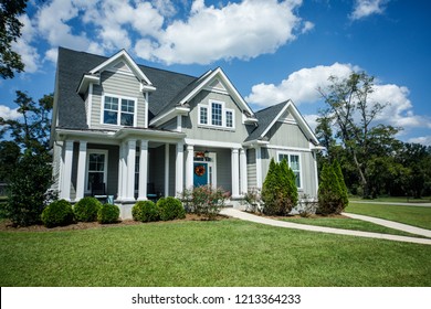 Gray New Construction Modern Cottage Craftsman Home With Hardy Board Siding And Teal Door With Curb Appeal