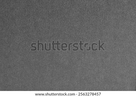 Gray paper texture with a robust, matte finish and a soft sheen. The industrial-inspired design features dark charcoal and steel tones, offering a sleek and modern aesthetic