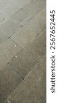 
Gray paving slabs urban street road floor stone tile texture background, top view. brick paving stones on a sidewalk
