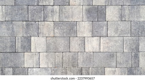 Gray paving stones. Paving surface road. Texture made of big gray cement bricks. Brick stone street road - pavement texture - Powered by Shutterstock