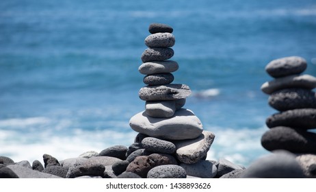 Gray Pebbles Stack With Blue Ocean In Background No People 