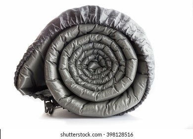 Gray Plastic Air Camping Mattress Rolled In The Back Isolated On White Background