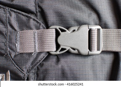 Gray Plastic Buckle On Backpack.