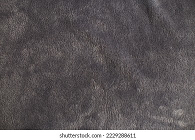 Gray plush fabric background texture, soft material pattern.