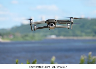 Gray quadcopter in flight. Photo-video aerial photography. . High quality photo
