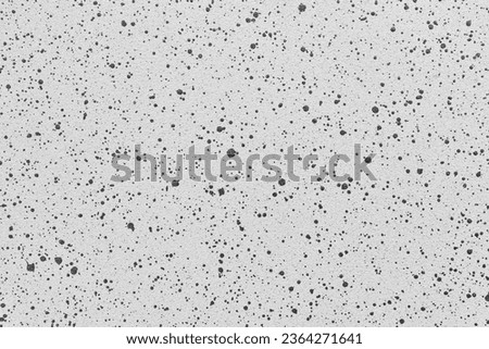 Gray quartz background or texture with irregural black dots. High resolution photography