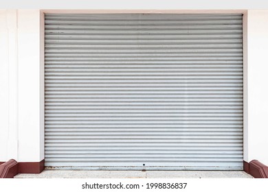 The Gray Roller Shutter Door Of The Store Is Closed