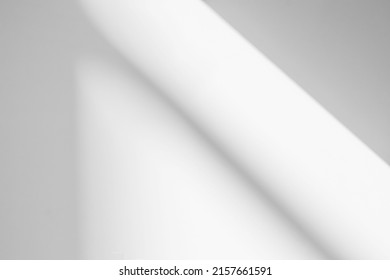 Gray shadow and light blur abstract background on white wall  from window.  Architecture stripe dark shadows indoor in room  background, monochrome, shadow overlay effect