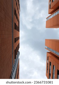 gray sky between two high-rise buildings standing next to each other