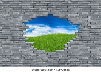 Gray Slate Stone Rock Wall With Breakthrough Hole Breakout Freedom Concept In Front Of Green Meadow With Blue Sky Background