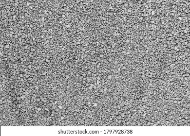 Gray small rocks ground texture. black small road stone background. gravel pebbles stone seamless texture, marble. dark background of crushed granite gravel, close up. grey clumping clay - Shutterstock ID 1797928738