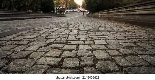gray stone road surface, cobbled road, cobble background. texture old stone pavement in the city