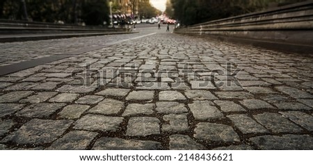gray stone road surface, cobbled road, cobble background. texture old stone pavement in the city