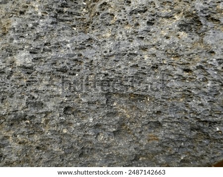Gray stone with roung texture and unique shapes to backdrop, decoration and background 