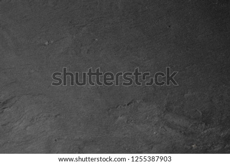 Gray stone texture closeup. Graphite gray