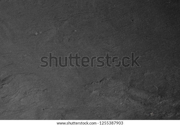 Gray stone texture\
closeup. Graphite gray