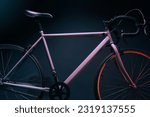 gray street sports bike in a dark room illuminated by red light