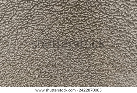 Gray structural background of surface of tempered glass, broken into small pieces. Destruction concept. Can be used as basis for warning text, design, safety announcement. Mock up, blank