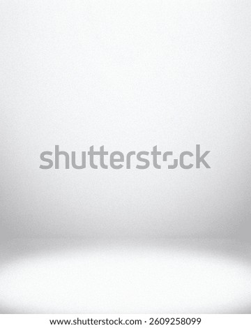 Gray studio backdrop with smooth gradient texture, soft lamp lighting, and subtle shadow effects, ideal for adding depth to portraits, product shots, or wallpapers.

