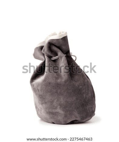 Gray suede bag with drawstring isolated on white background.