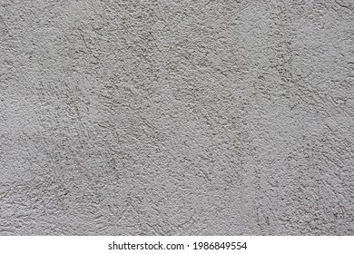 Gray texture background. Concrete wall. Rough surface. Stone texture. Uneven, scratched, lumpy.
