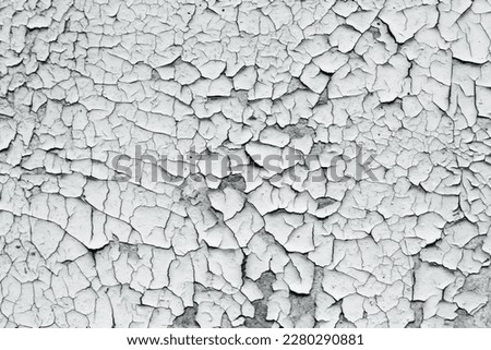 Gray texture of old cracked paint, grunge background.
