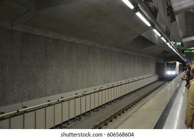 The gray underground station. Arrival of the train.