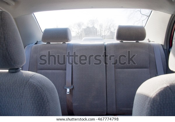 Gray\
velvet Rear seats car with seat belts.car\
interior