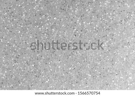 Gray wall with black spots and scratches background texture. abstract surface