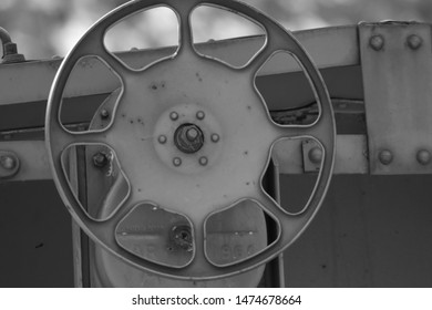 Gray And White Train Car Steering Column. 