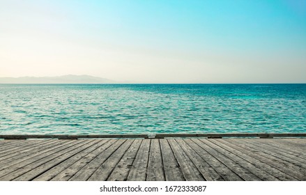 gray wooden pier of free space for your decoration and landscape of ocean with blue sky 